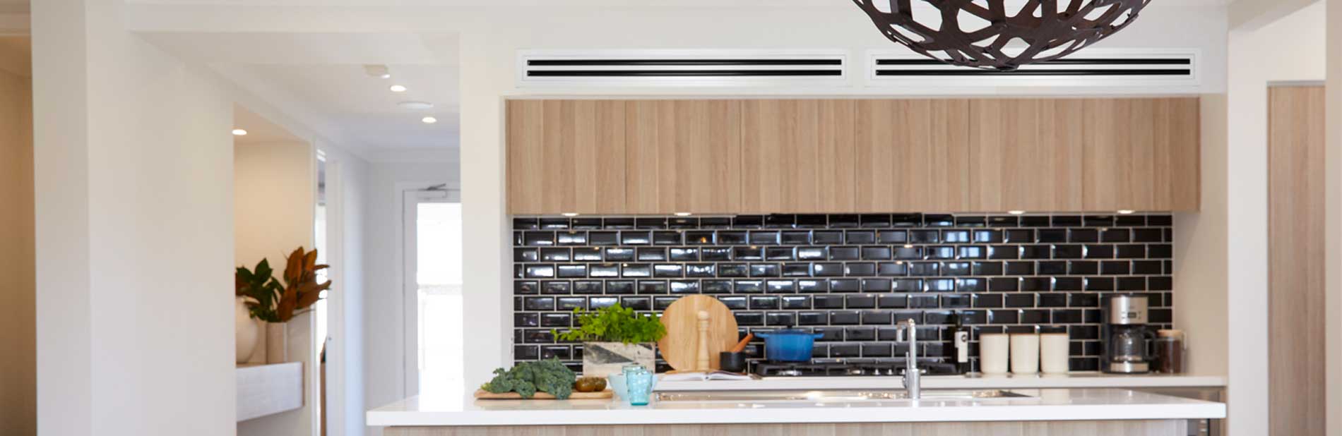 Interior of kitchen area installed with daikin ducted air conditioning system